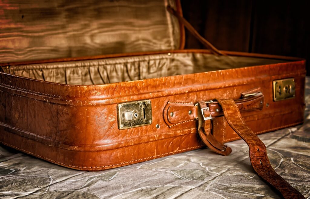 Suitcase packed with essential items for an Ayahuasca retreat, including natural fabrics, comfortable clothing, and personal items for a healing journey.